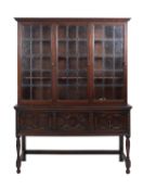 An oak and glazed dresser in William & M