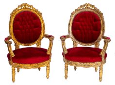 A pair of carved, giltwood and upholster