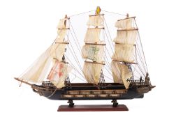 A wooden model of a 22 gun sixth rate ship of the line.