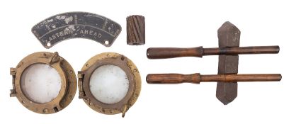 Two circular brass portholes.