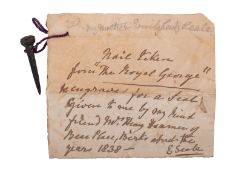 HMS 'Royal George'. A salvaged nail with foul anchor seal engraved head, 4.2cm long.