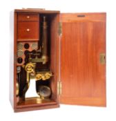 An early 20th century lacquered brass monocular microscope, maker Baker, London,