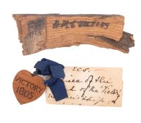 HMS 'Victory'. A small section of heart shaped timber engraved 'Victory 1805'