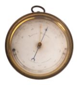 An early 20th century lacquered brass circular aneroid barometer unsigned with silvered vernier