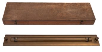 A late 20th century cased brass parallel rule indistinctly engraved,
