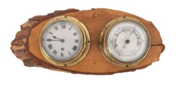 A 20th Century bulkhead clock and barometer, both having brass bodies,
