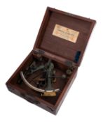 An early 20th century 8 inch vernier brass sextant unsigned the brass arc inset silvered arch