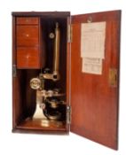 A Victorian brass compound binocular microscope, maker C Collins, London,