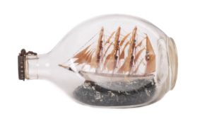 An early 20th Century model ship in bottle of the four masted barque 'Herzogin Cecile'.
