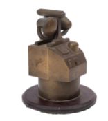 A brass desk model of a warship's gun fire control system, on a circular bakelite plinth, 13.