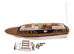 A scratch built model of a pleasure boat.