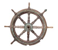 A teak and brass ship's helm with block and turned spars,