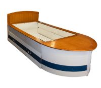 A contemporary wooden single bed in the form of a boat.