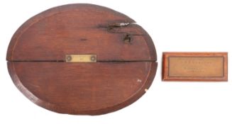 A teak and brass paperweight made from the timbers of HMS 'Vindictive',