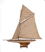 A 20th Century gaff rigged pond yacht.