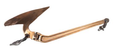 A 20th Century brass plow anchor, having brass shank and fluke, with metal ring and chain,