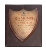 A teak and brass commemorative shield plaque for the Royal Navy Battleship HMS 'Victoria',