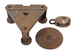 A bronze triangular ship's stanchion,
