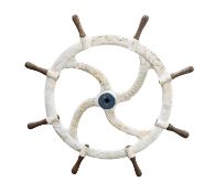 A late 19th/early 20th Century cast iron four spoke sailing barge helm, maker R Gardiner.
