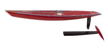 Three model sailing boat hulls.