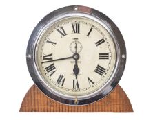 A 20th Century aluminium bulkhead clock, maker Henry Brown and Son.