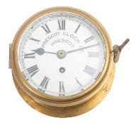 An early 20th century brass bulkhead clock, maker Prescot Clock Co.