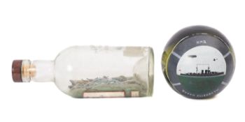 An early 20th Century glass float decorated with a scene of HMS 'Queen Elizabeth'.