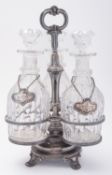 A William IV Sheffield plate and glass revolving three bottle decanter set, not marked,