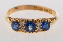 A Victorian 18ct gold sapphire and diamond ring, set with three oval-cut sapphires,