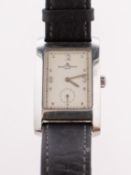 Baume & Mercier a stainless-steel rectangular watch the cream dial having raised Arabic and block