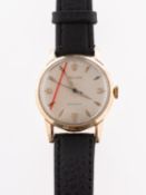 Rolex Precision, a gold gentleman's wristwatch the cream dial with raised baton and Arabic numerals,