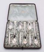 A cased set of six Vine pattern pointed grape fruit spoons by Tiffany & Co,