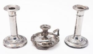 A George IV silver chamberstick and snuffer maker's mark poorly struck, probably London, 1828,