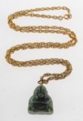 A green hardstone Buddha pendant with chain,