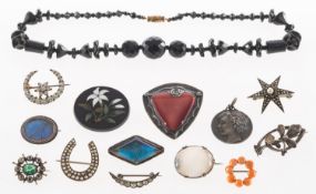 A group of antique costume and silver jewellery, including a string of faceted black beads,