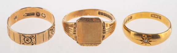 A group of three rings, including a 9ct gold signet ring, UK hallmark, size S1/2, 3.