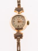 Longines a lady's vintage 9K gold Longines mechanical wind wristwatch,