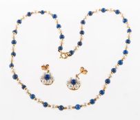 A lapis lazuli and pearl necklace and a pair of lapis lazuli and pearl earrings,