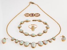 A group of opal set jewellery, including a chain link necklace,