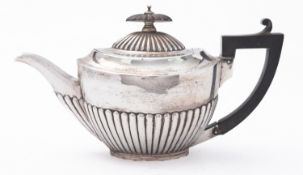A Victorian silver bachelor's tea pot by Goldsmiths & Silversmiths Co, Sheffield 1884,