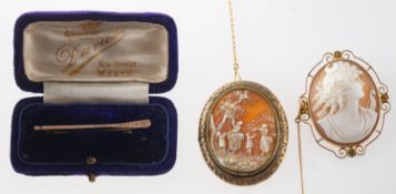 A group of three brooches, including a cameo brooch with an openwork floral mount,