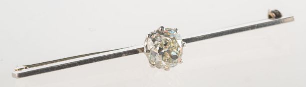 A diamond bar brooch, claw set to the centre with a cushion-cut diamond, diamond approx. 2.