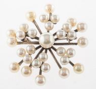 Mikimoto. A starburst pearl brooch,