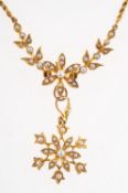 A Victorian floral & foliate seed pearl necklace, with detachable floral pendant drop,