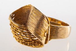A 1970's 9ct gold ring, an abstract openwork ring with a textured and openwork mesh finish,