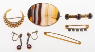 A group of five antique and vintage brooches and a pair of earrings,
