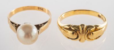 A group of two rings, including a scroll designed ring, marked 750, size N1/2 to O, 4.