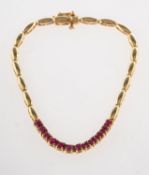 A ruby set bracelet, an articulated oval link bracelet,