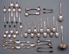 A mixed group of silver spoons including; three Art Nouveau tea spoons by Liberty & Co Ltd,