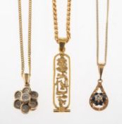 A group of four necklaces, including a 'wavy' linked necklace, UK import mark for 375 to clasp,